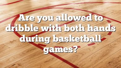 Are you allowed to dribble with both hands during basketball games?