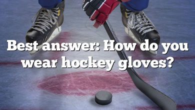 Best answer: How do you wear hockey gloves?