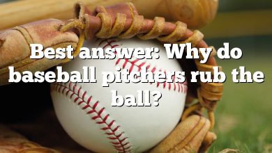 Best answer: Why do baseball pitchers rub the ball?