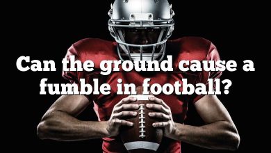 Can the ground cause a fumble in football?