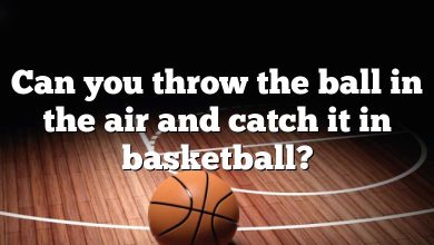 Can you throw the ball in the air and catch it in basketball?