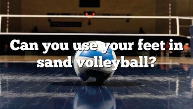 Can you use your feet in sand volleyball?