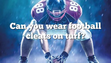 Can you wear football cleats on turf?