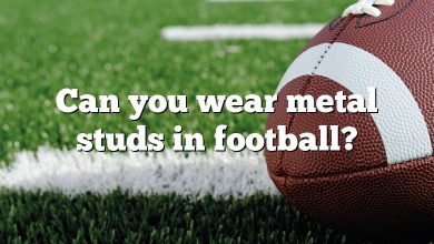 Can you wear metal studs in football?