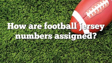 How are football jersey numbers assigned?