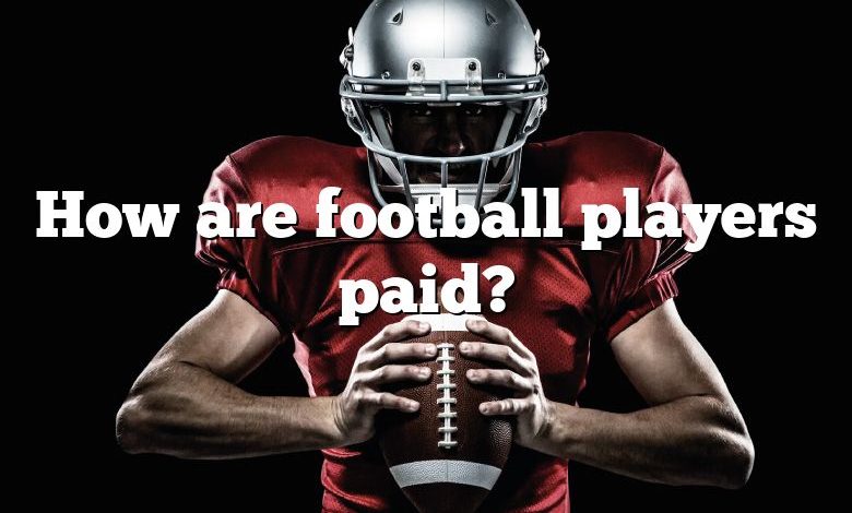 How are football players paid?