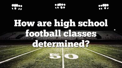 How are high school football classes determined?