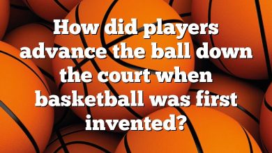 How did players advance the ball down the court when basketball was first invented?