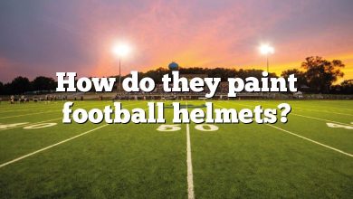 How do they paint football helmets?