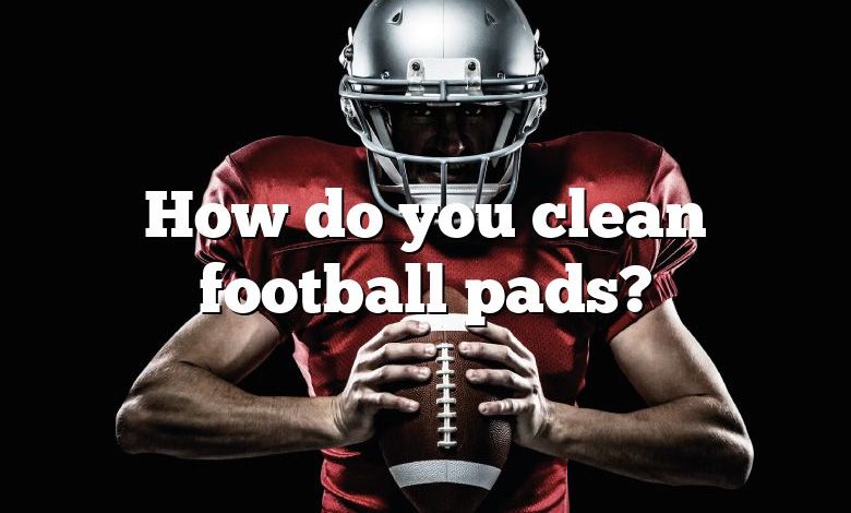 How do you clean football pads?