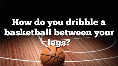 How do you dribble a basketball between your legs?