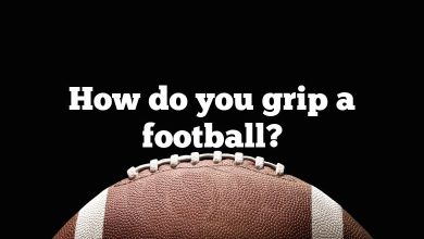 How do you grip a football?