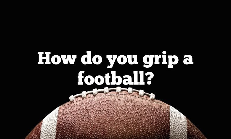 How do you grip a football?