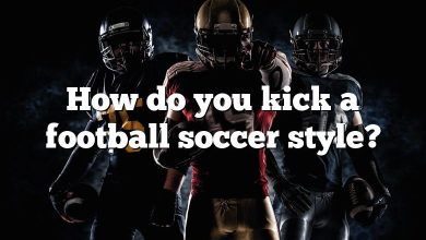 How do you kick a football soccer style?