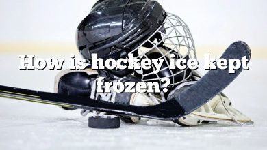 How is hockey ice kept frozen?