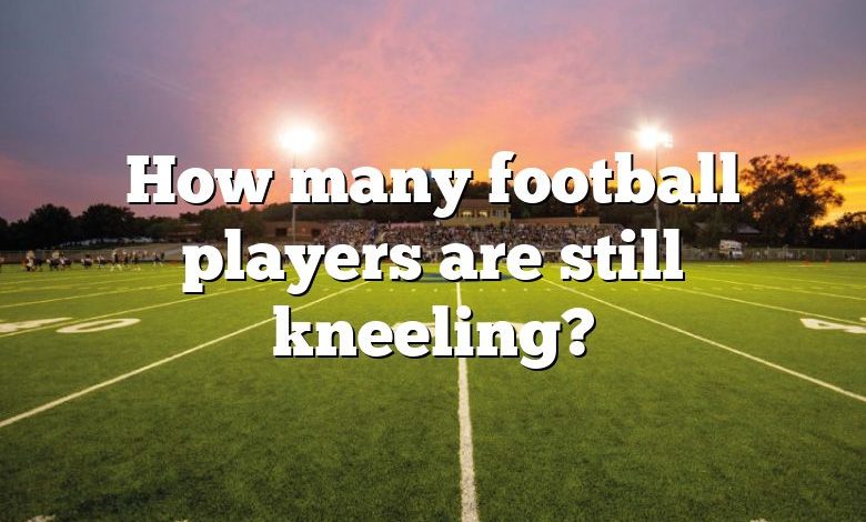 How many football players are still kneeling?