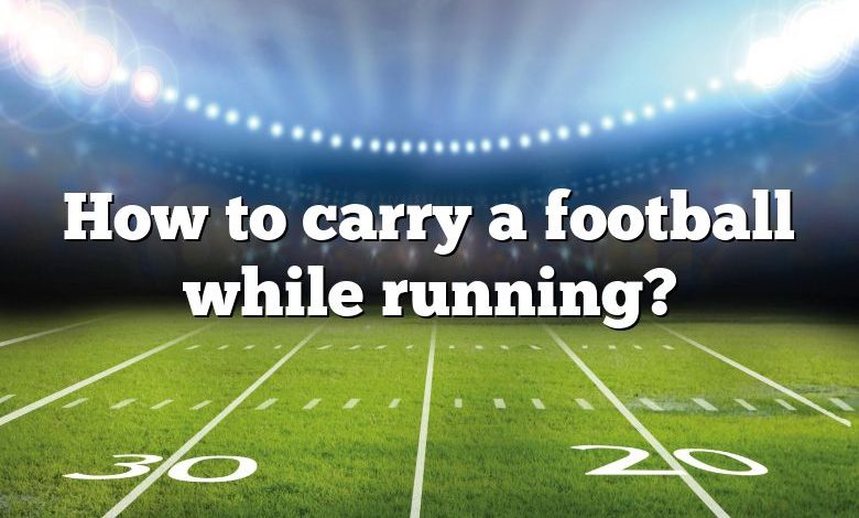 How to carry a football while running?