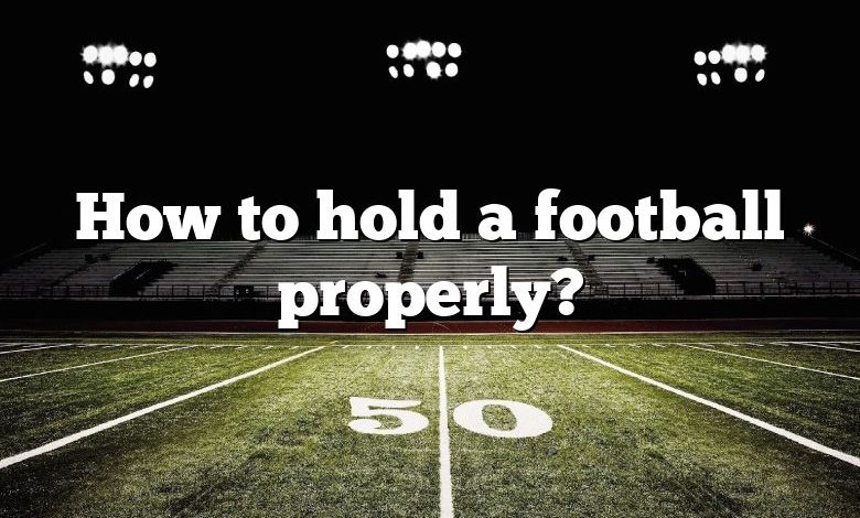 How to hold a football properly?