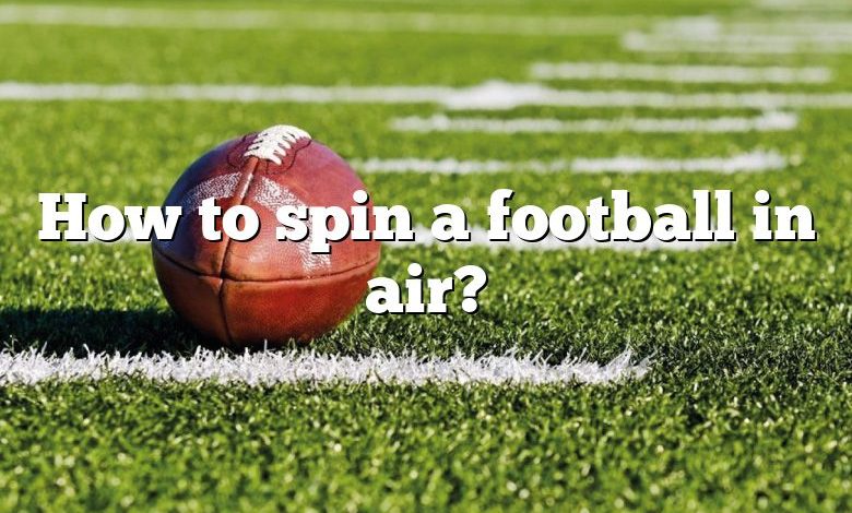 How to spin a football in air?