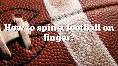 How to spin a football on finger?