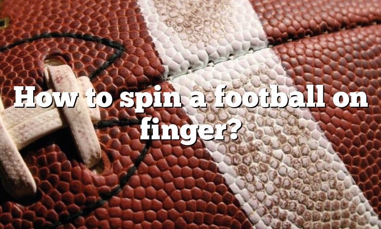 How to spin a football on finger?