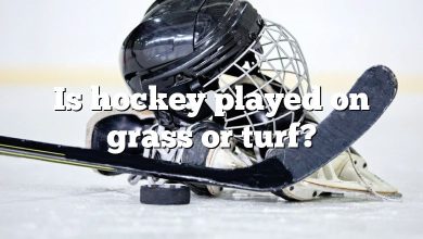 Is hockey played on grass or turf?