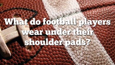 What do football players wear under their shoulder pads?