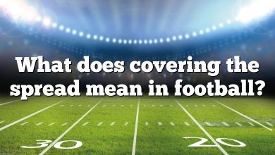 What does covering the spread mean in football?