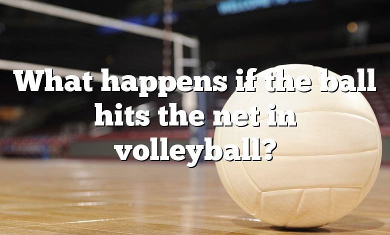 What happens if the ball hits the net in volleyball?