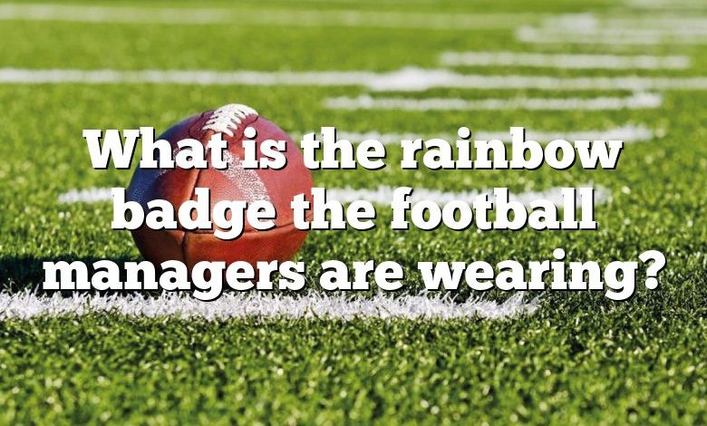 What is the rainbow badge the football managers are wearing?