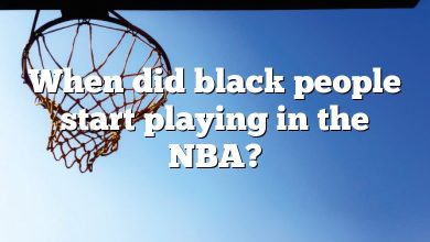 When did black people start playing in the NBA?