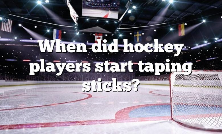 When did hockey players start taping sticks?