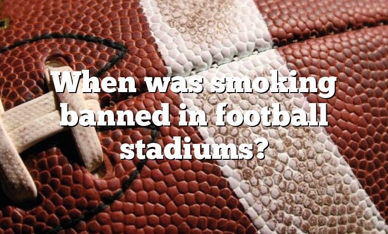 When was smoking banned in football stadiums?