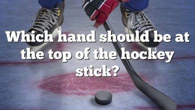 Which hand should be at the top of the hockey stick?