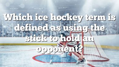 Which ice hockey term is defined as using the stick to hold an opponent?