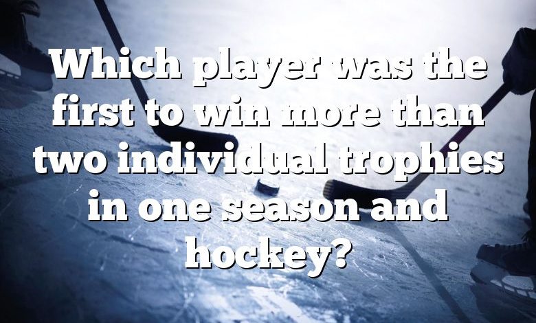 Which player was the first to win more than two individual trophies in one season and hockey?