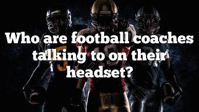 Who are football coaches talking to on their headset?