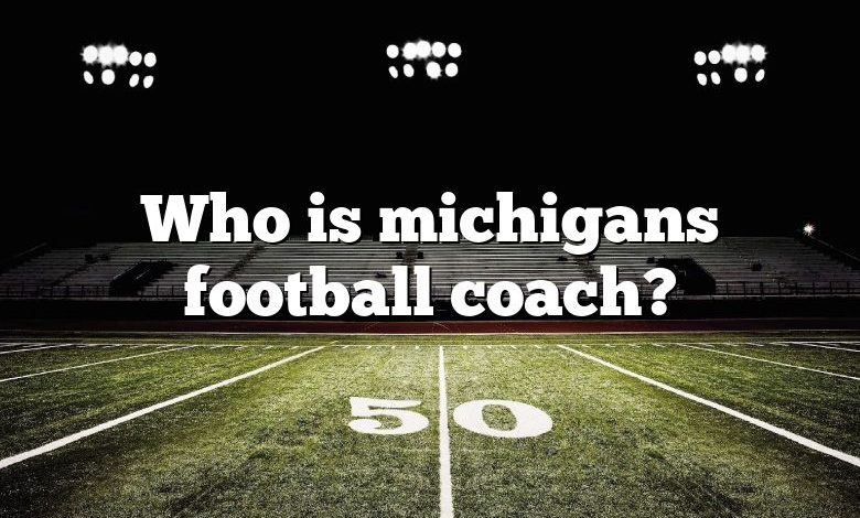 Who is michigans football coach?
