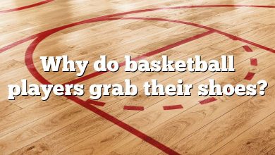 Why do basketball players grab their shoes?