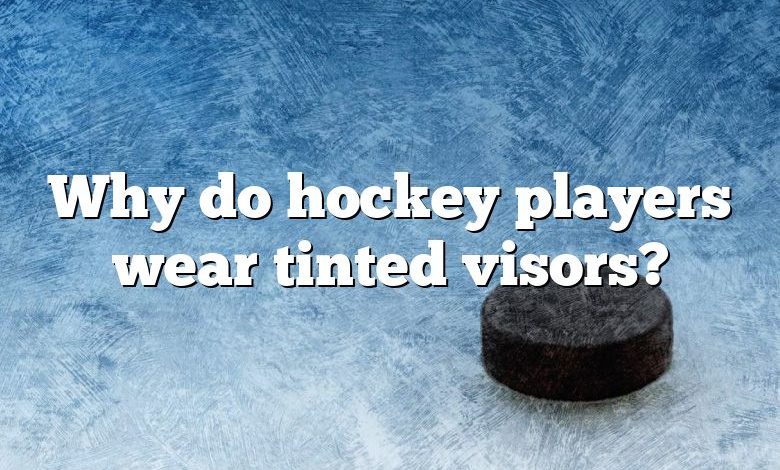 Why do hockey players wear tinted visors?